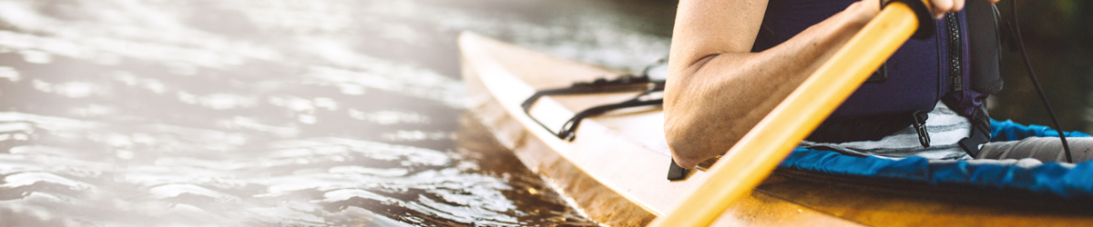 A rower propels a kayak up a stream in Washington state