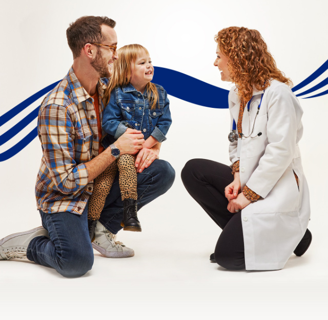 man holding child speaking to a female provider