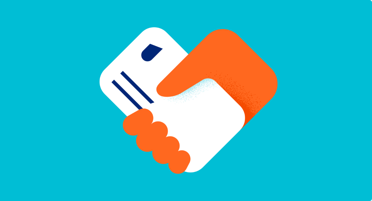 Handshake between an orange hand and a white UHC member ID card
